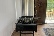 کلبه سوئیسی تکخواب جکوزی دار آیهان در ماسال | نمای داخل کلبه همراه با فوتبال دستی