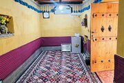 اتاق بابشاد سیرافی در اقامتگاه بومگردی کنگان