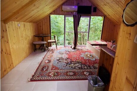 کلبه چوبی در شیرگاه